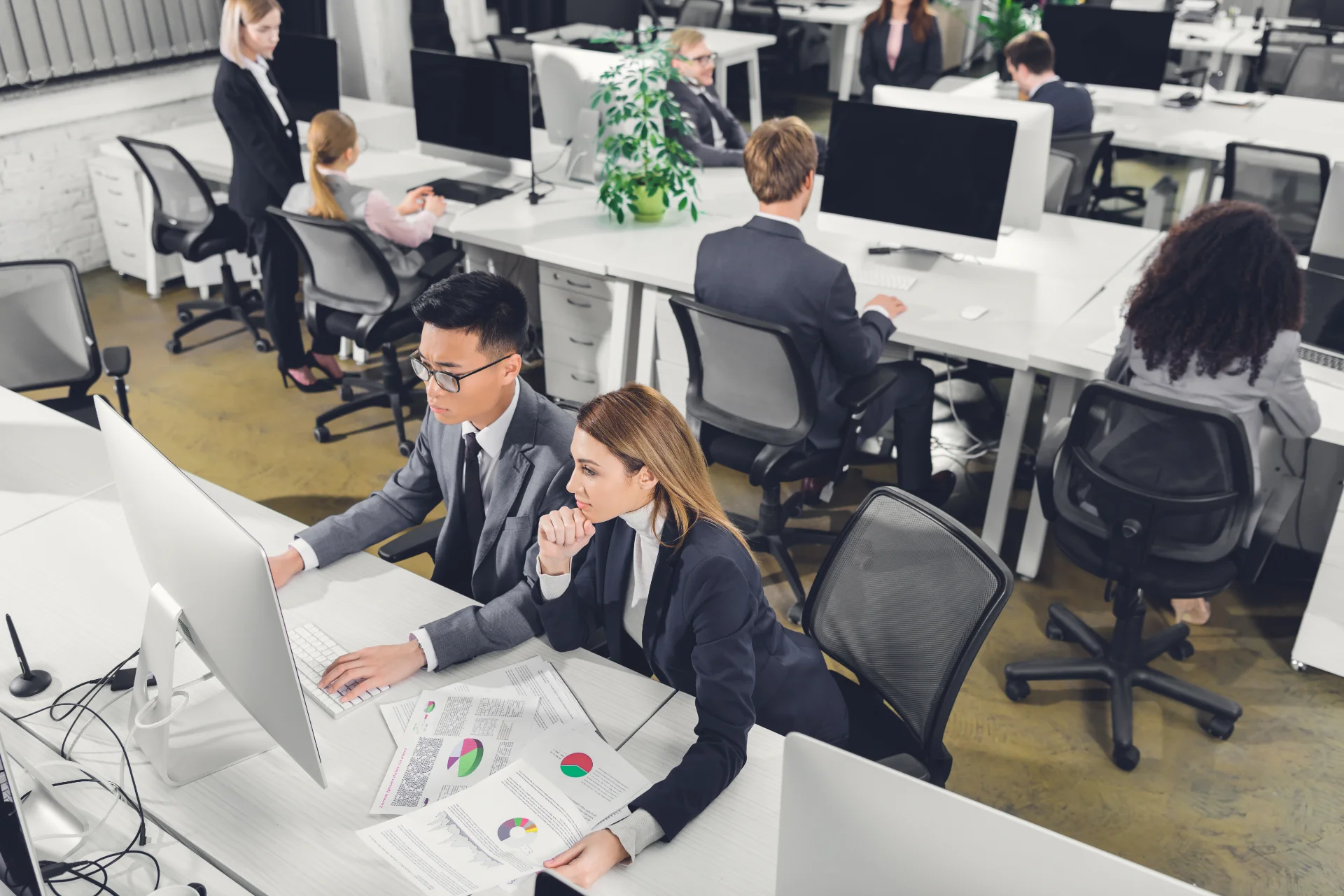 How to Grow Your Business: Offshoring Strategy 101 1 high-angle-view-of-multiracial-businesspeople-work